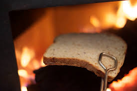 Toasting bread over fire